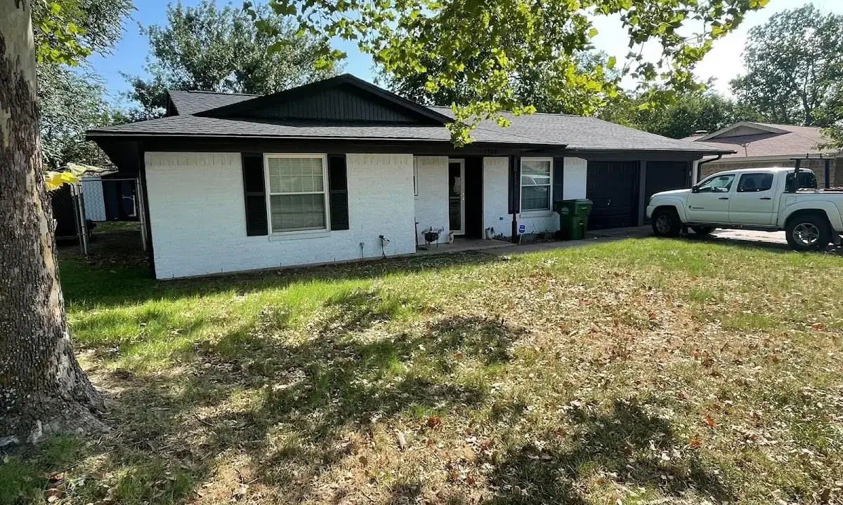 Professional roofing crew working on a residential roof in Avra Valley